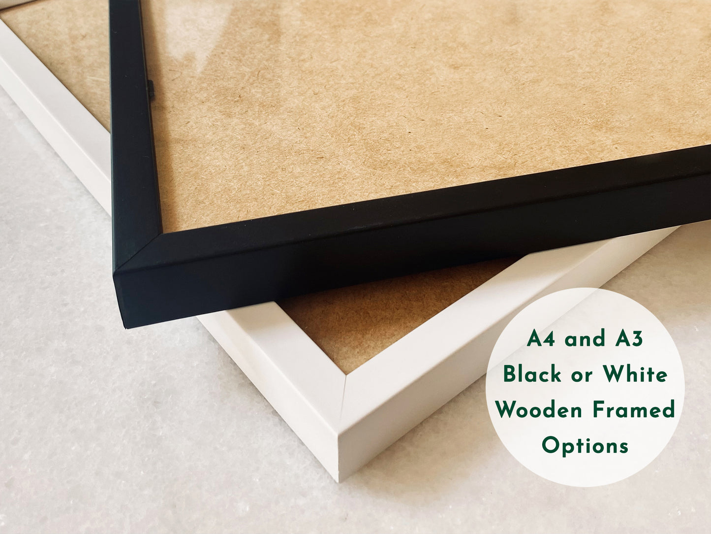Close-up image showcasing black and white wooden frame options for prints, displayed on a light surface. Text overlay reads: A4 and A3 Black or White Wooden Framed Options