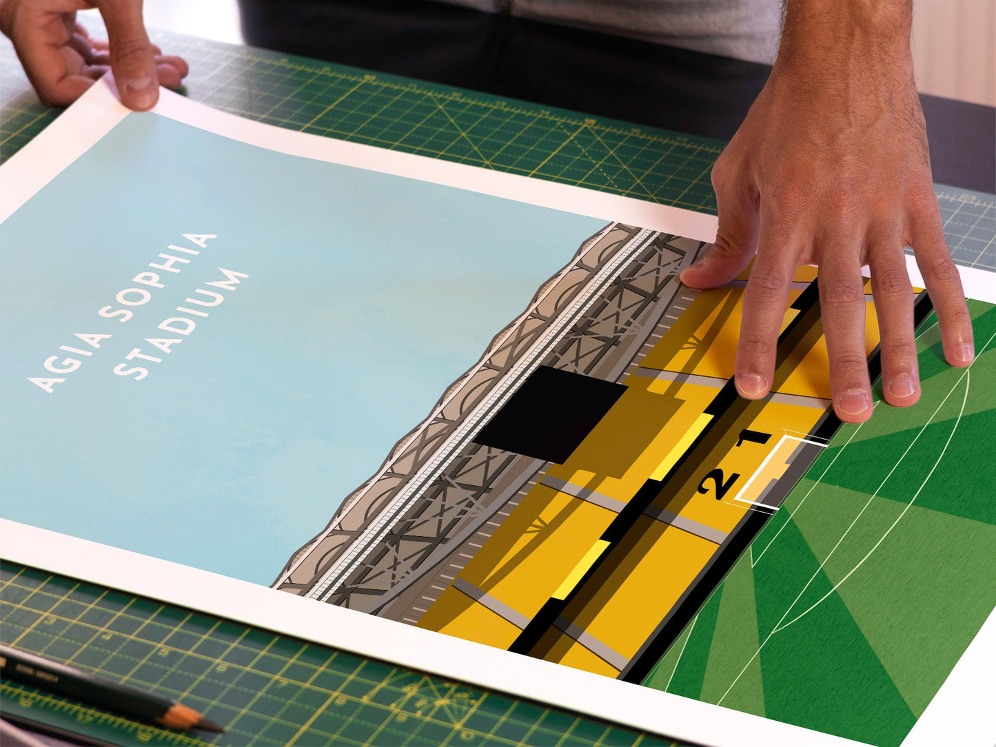 A photo in our printing studio, of one of our illustrated art prints of the Agia Sophia Stadium / OPAP Arena after it has been printed and is about to be packaged.