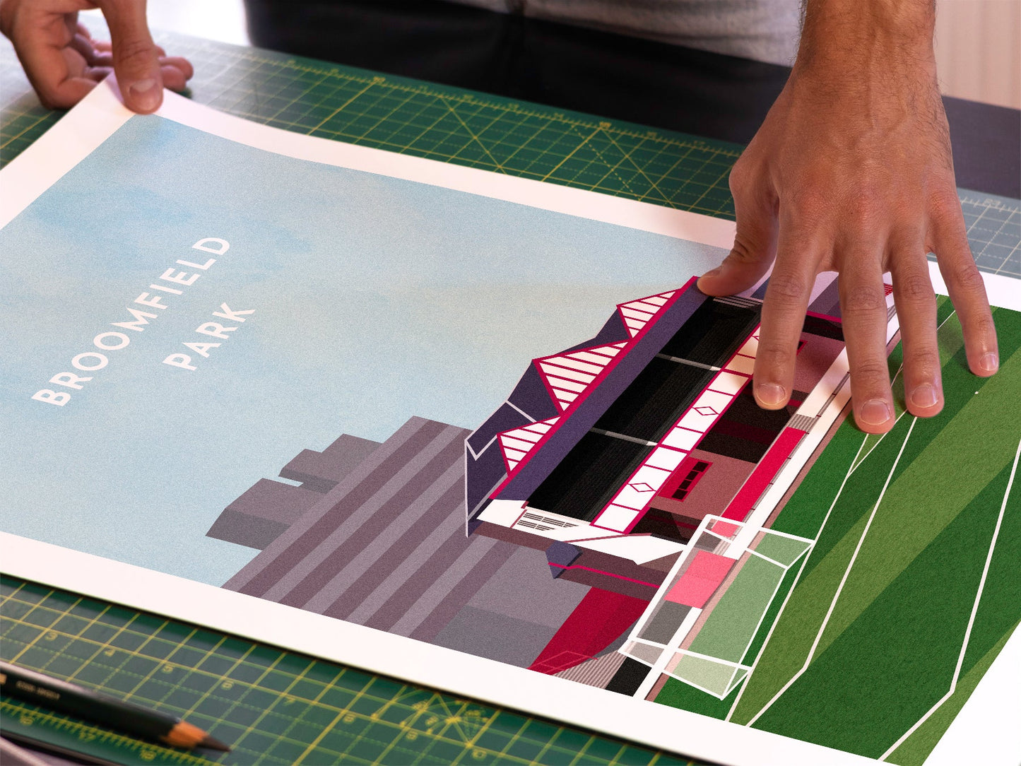 A photo in our printing studio, of one of our illustrated art prints of Broomfield Park after it has been printed and is about to be packaged.