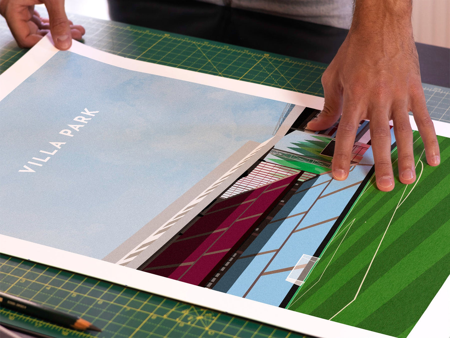A photo in our printing studio, of one of our illustrated art prints of Villa Park after it has been printed and is about to be packaged.