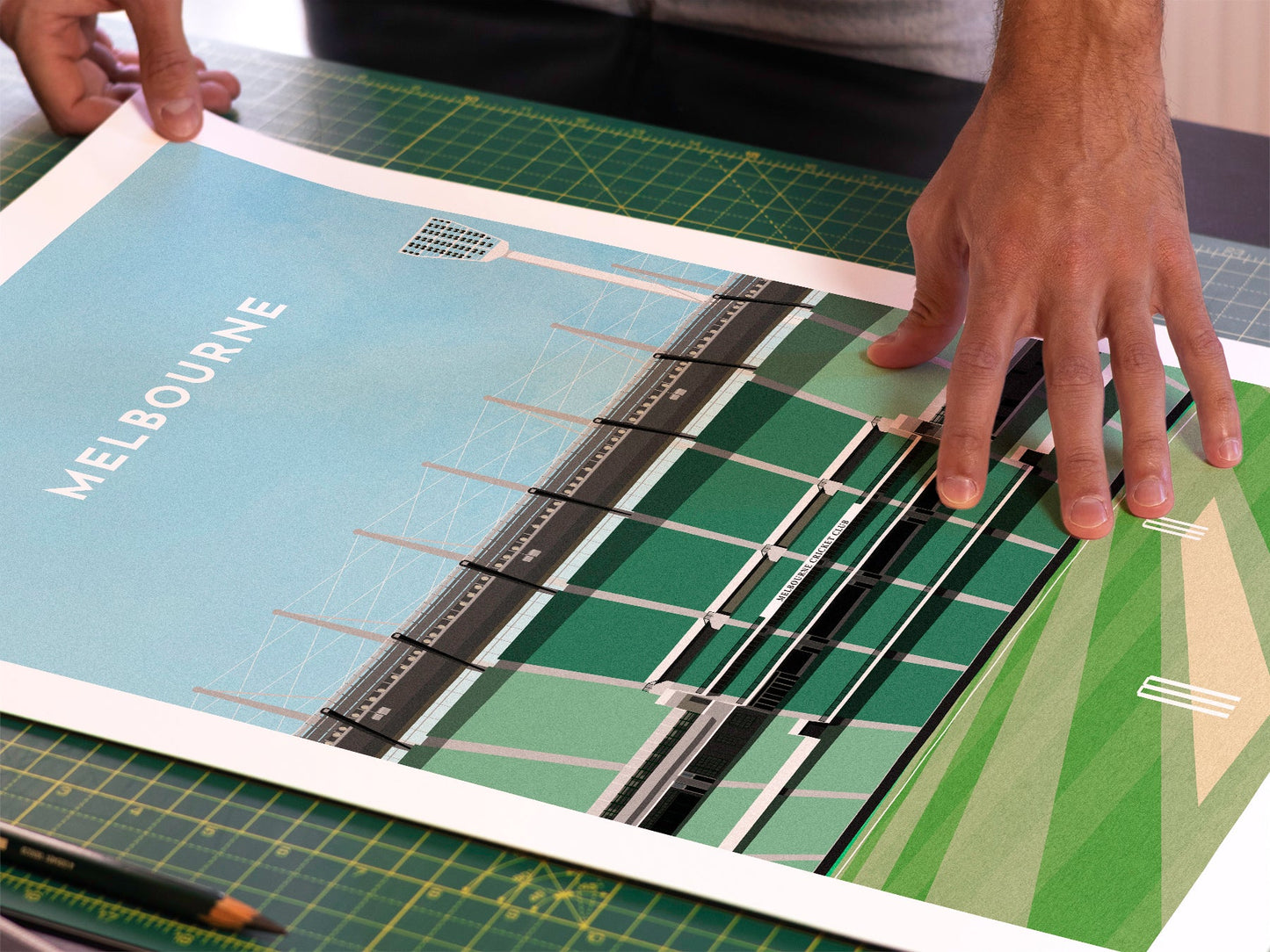 A photo in our printing studio, of one of our illustrated art prints of the MCG after it has been printed and is about to be packaged.