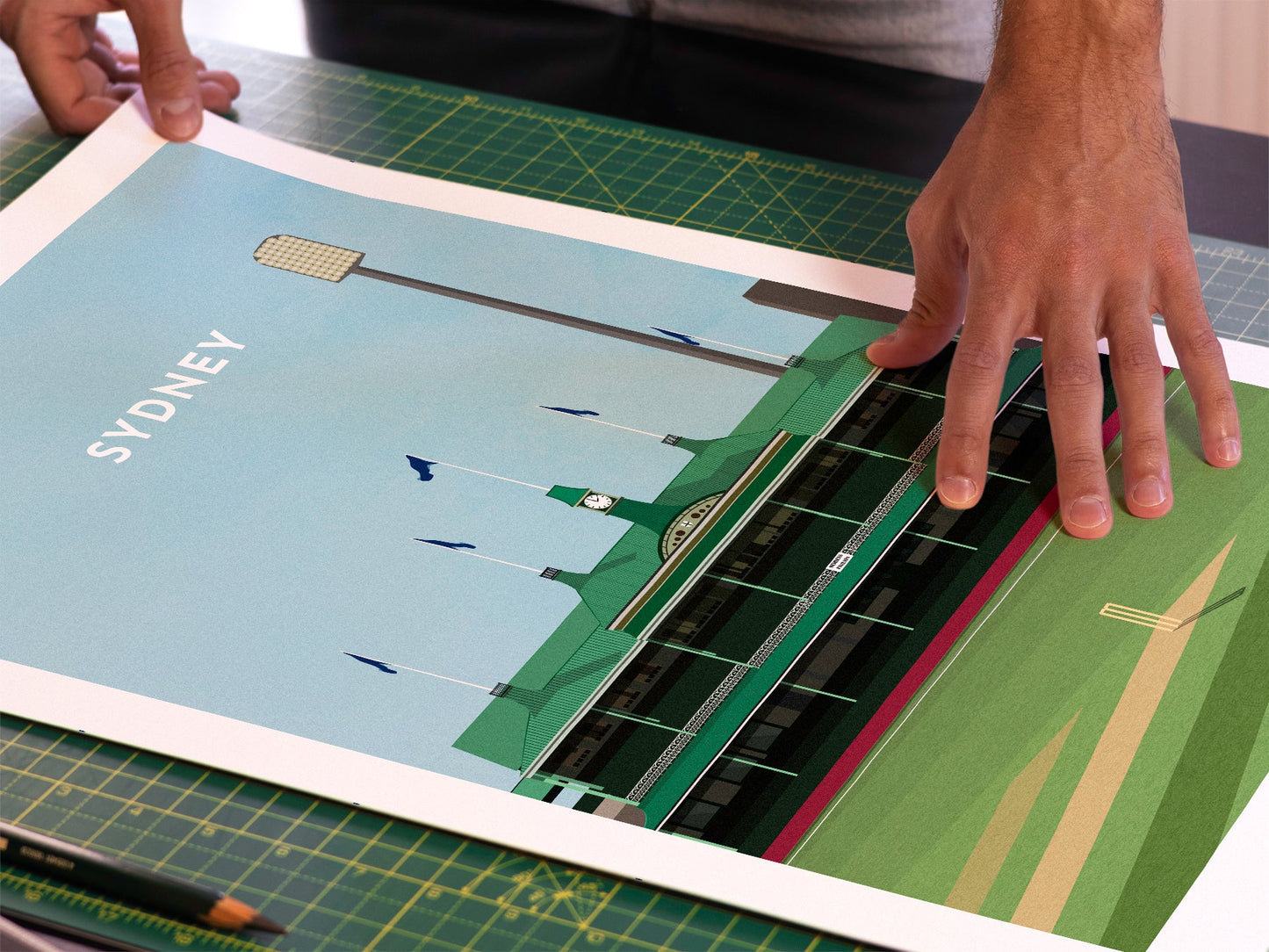 A photo in our printing studio, of one of our illustrated art prints of SCG after it has been printed and is about to be packaged.