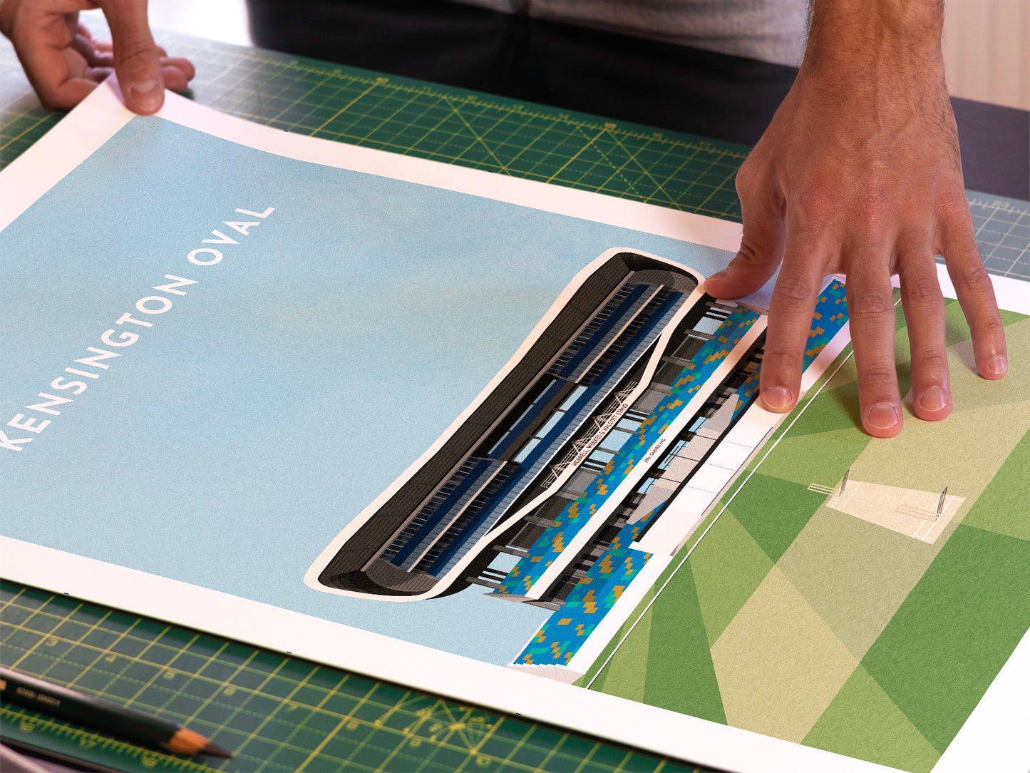 A photo in our printing studio, of one of our illustrated art prints of Kensington Oval after it has been printed and is about to be packaged.