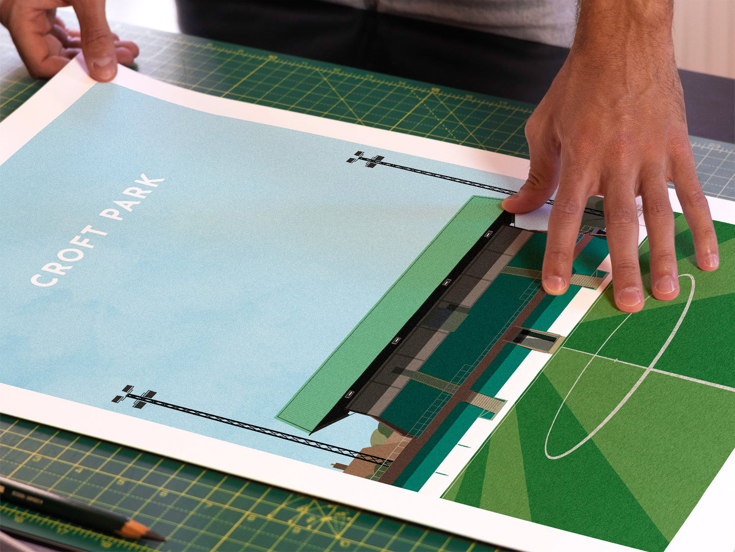 A photo in our printing studio, of one of our illustrated art prints of Croft Park after it has been printed and is about to be packaged.