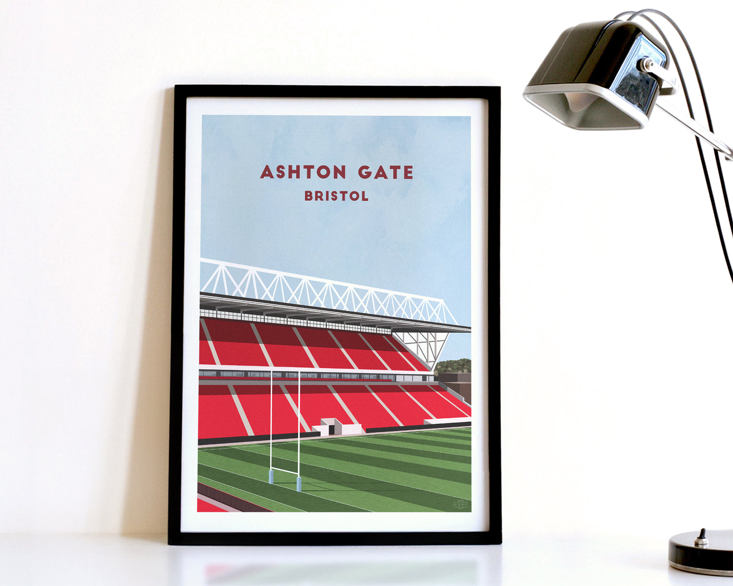 A modern style Bristol Bears Print, featuring a contemporary illustration of their home stadium the Ashton Gate in Bristol, displayed within a black frame.