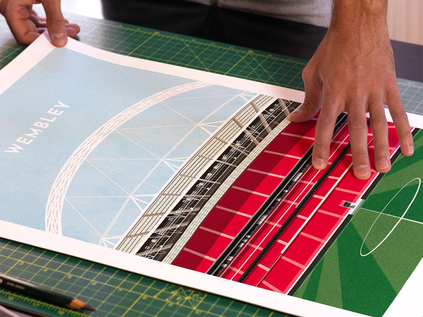 A photo in our printing studio, of one of our illustrated art prints of Wembley after it has been printed and is about to be packaged.