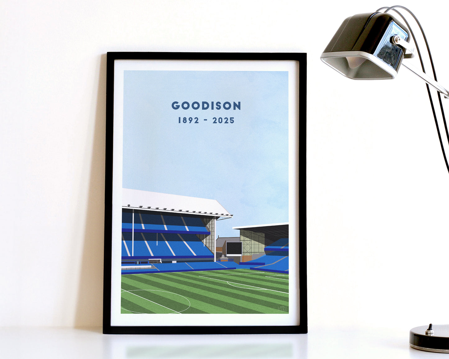A modern style Everton Print, featuring a contemporary illustration of their former home stadium Goodison Park in Liverpool, displayed within a black frame.