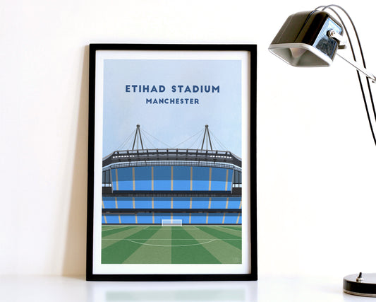 A modern style Manchester City Print, featuring a contemporary illustration of their home stadium the Etihad Stadium in Manchester, displayed within a black frame.