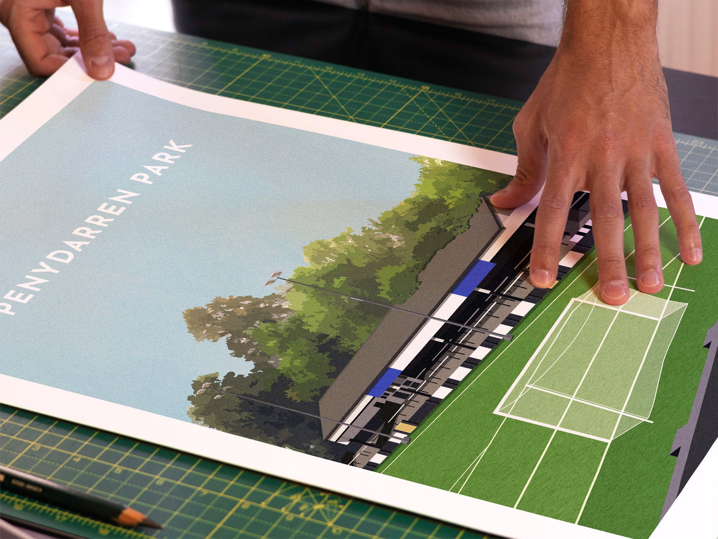 A photo in our printing studio, of one of our illustrated art prints of Penydarren Park after it has been printed and is about to be packaged.