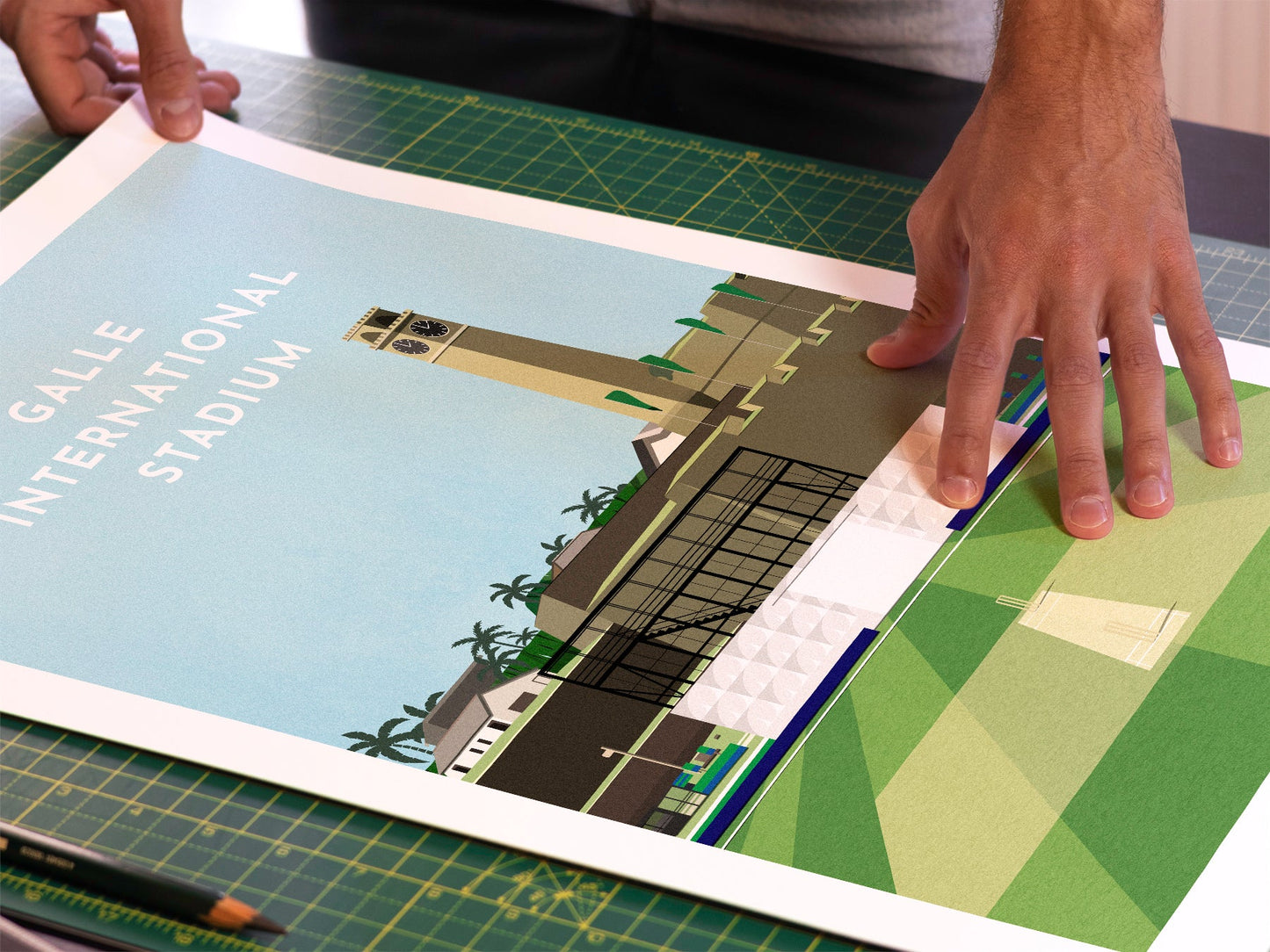 A photo in our printing studio, of one of our illustrated art prints of Galle International Stadium after it has been printed and is about to be packaged.
