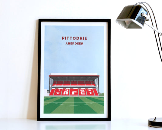 A modern style Aberdeen FC Poster, featuring a contemporary illustration of their home stadium the Pittodrie Stadium in Aberdeen, displayed within a black frame.