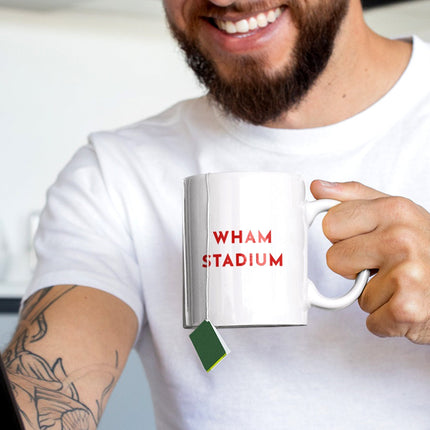 Reverse side of White Ceramic Mug with Wham Stadium text in Red. 