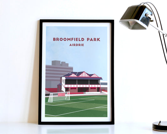 A modern style Airdrie FC Poster, featuring a contemporary illustration of their former home stadium Broomfield Park in Airdrie, displayed within a black frame.