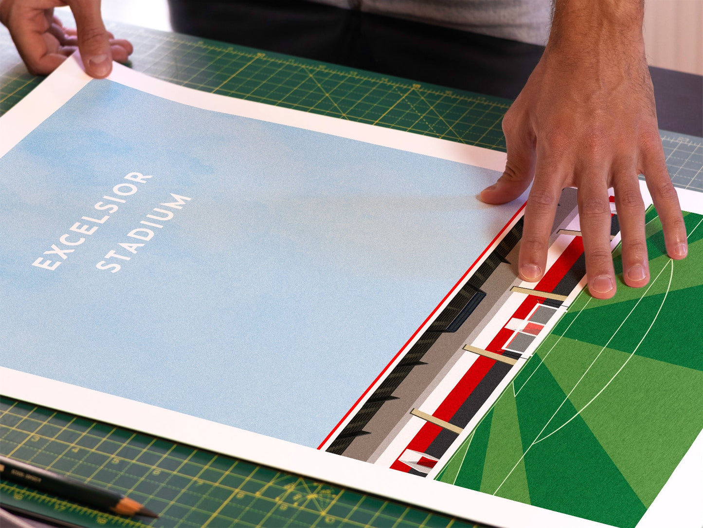 A photo in our printing studio, of one of our illustrated art prints of Excelsior Stadium after it has been printed and is about to be packaged.