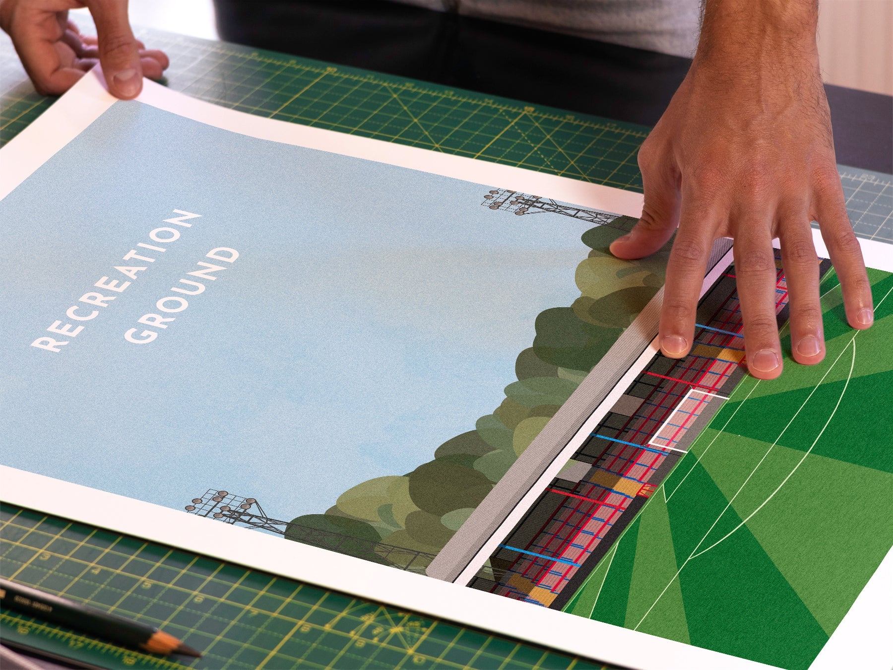 A photo in our printing studio, of one of our illustrated art prints of the Recreation Ground / EBB Stadium after it has been printed and is about to be packaged.