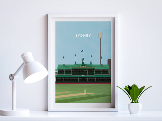 A contemporary style illustration of Australia and Sydney's Cricket Ground, the SCG, displayed as an art print within a white frame in a minimalist home office setting. 