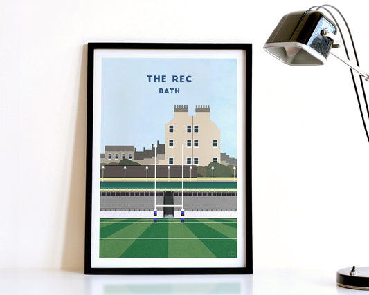 A modern style Bath Rugby Print, featuring a contemporary illustration of their home stadium The Rec in Bath, displayed within a black frame.