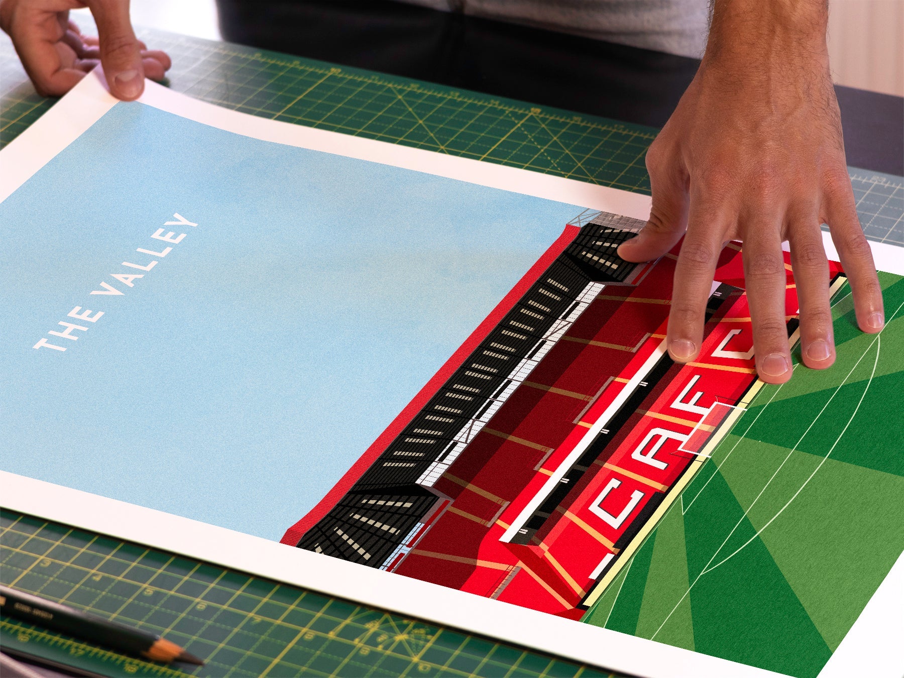 A photo in our printing studio, of one of our illustrated art prints of The Valley after it has been printed and is about to be packaged.