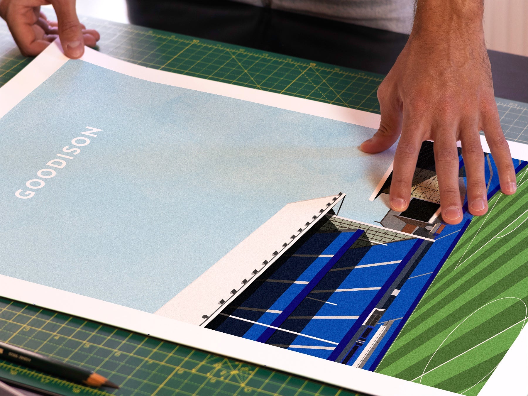 A photo in our printing studio, of one of our illustrated art prints of Goodison after it has been printed and is about to be packaged.
