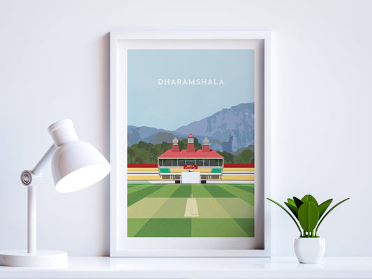 A contemporary style illustration of Himachal Pradesh's cricket stadium, the HPCA Stadium in Dharamshala, displayed as an art print within a white frame in a minimalist home office setting. 