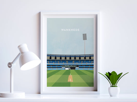 A contemporary style illustration of India and Mumbai's cricket stadium, Wankhede Stadium, displayed as an art print within a white frame in a minimalist home office setting. 