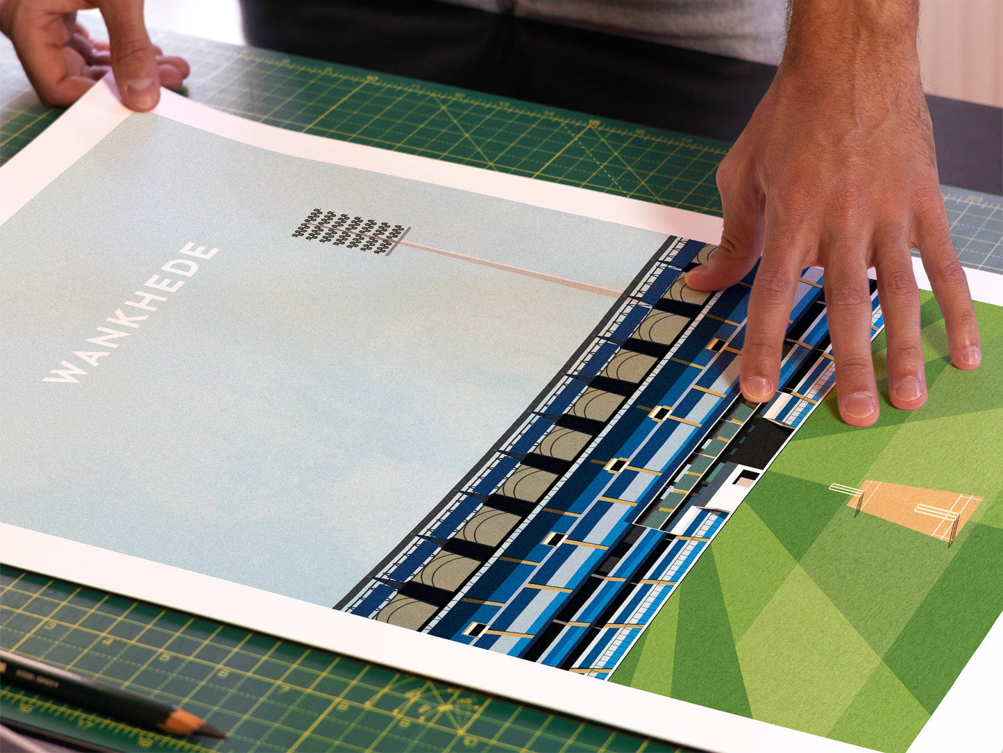 A photo in our printing studio, of one of our illustrated art prints of Wankhede Stadium after it has been printed and is about to be packaged.