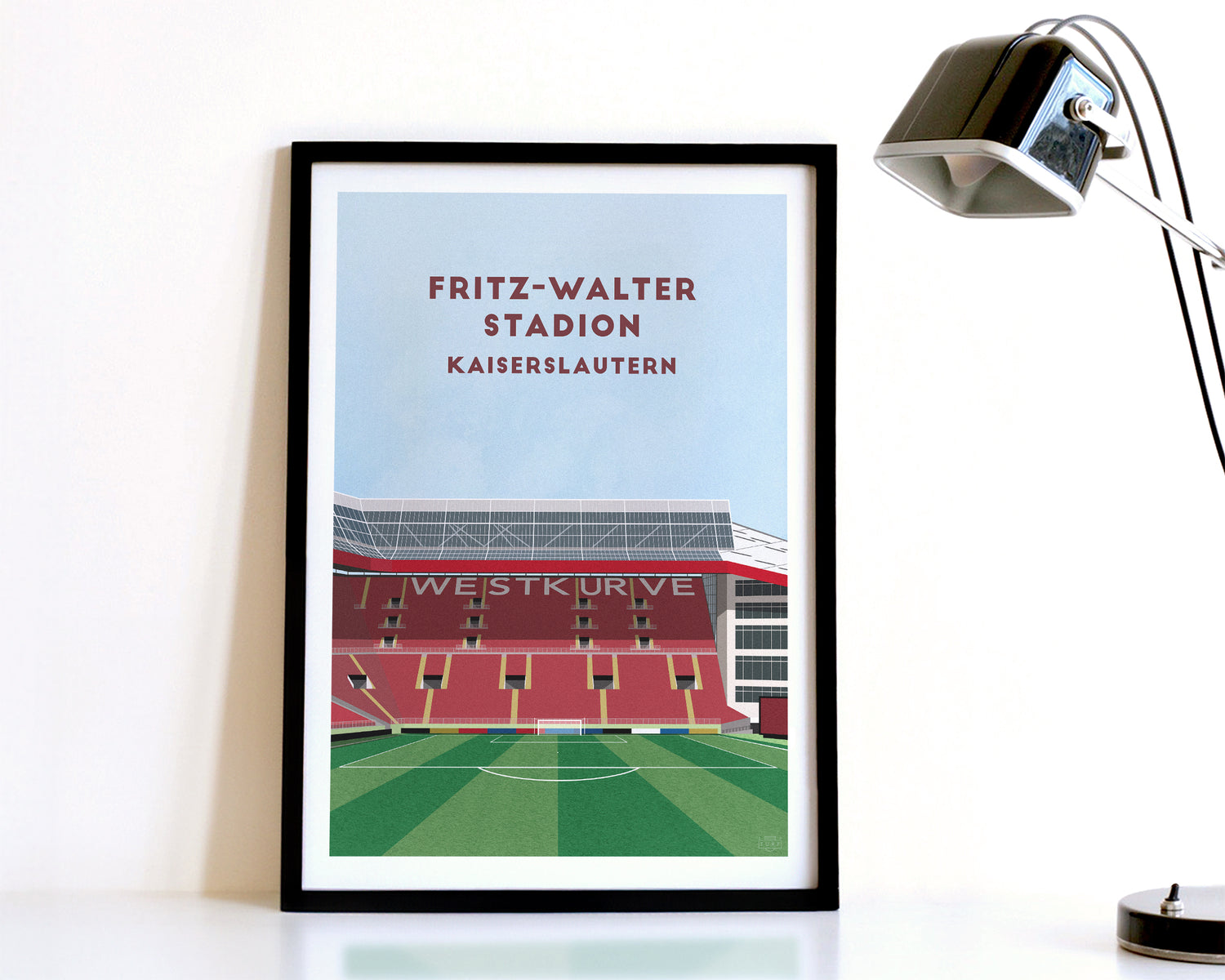 A modern style Kaiserslautern Print, featuring a contemporary illustration of their home stadium the Fritz-Walter Stadion in Kaiserslautern, displayed within a black frame.