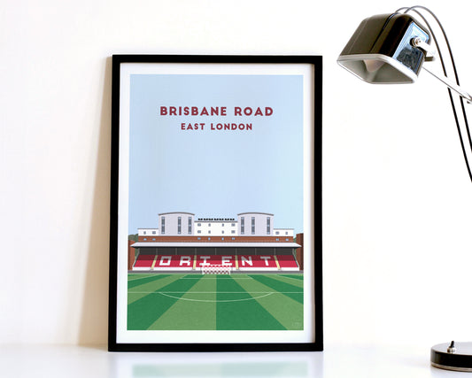 A modern style Leyton Orient Print, featuring a contemporary illustration of their home stadium the Brisbane Road in East London, displayed within a black frame.