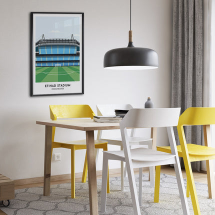Framed illustration print of Etihad Stadium in Manchester, home to City, showcasing a minimalist design with vibrant sky blue stands, green football pitch, under a blue sky.
