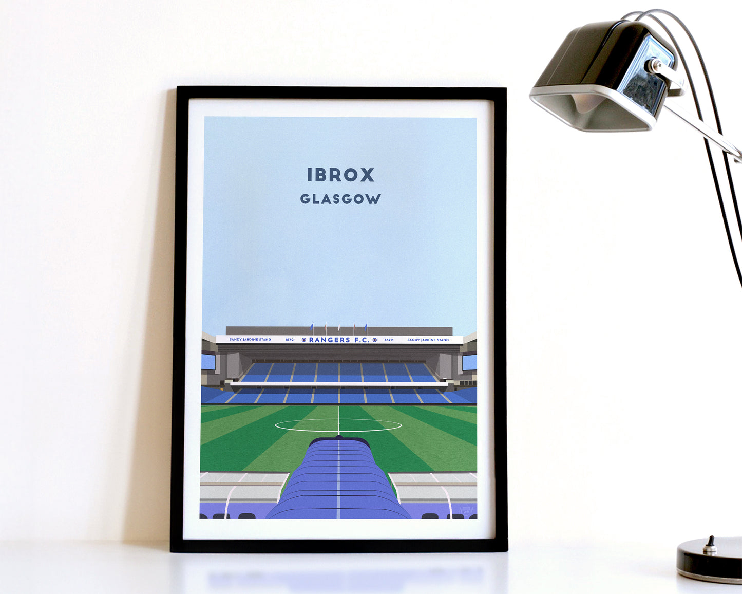 A modern style Rangers Print, featuring a contemporary illustration of their home stadium Ibrox in Glasgow, displayed within a black frame.