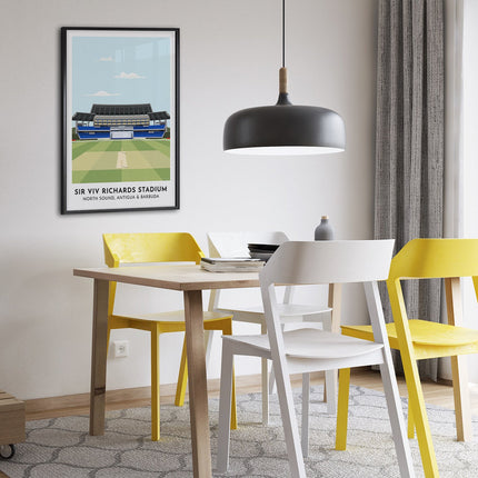Framed illustration print of the Sir Viv Richards Stadium in North Sound, home to West Indies Cricket and Antigua & Barbuda Cricket, showcasing a minimalist design with vibrant blue stands, green cricket pitch, under a blue sky.