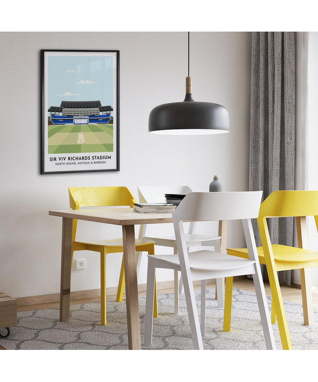 Framed illustration print of the Sir Viv Richards Stadium in North Sound, home to West Indies Cricket and Antigua & Barbuda Cricket, showcasing a minimalist design with vibrant blue stands, green cricket pitch, under a blue sky.