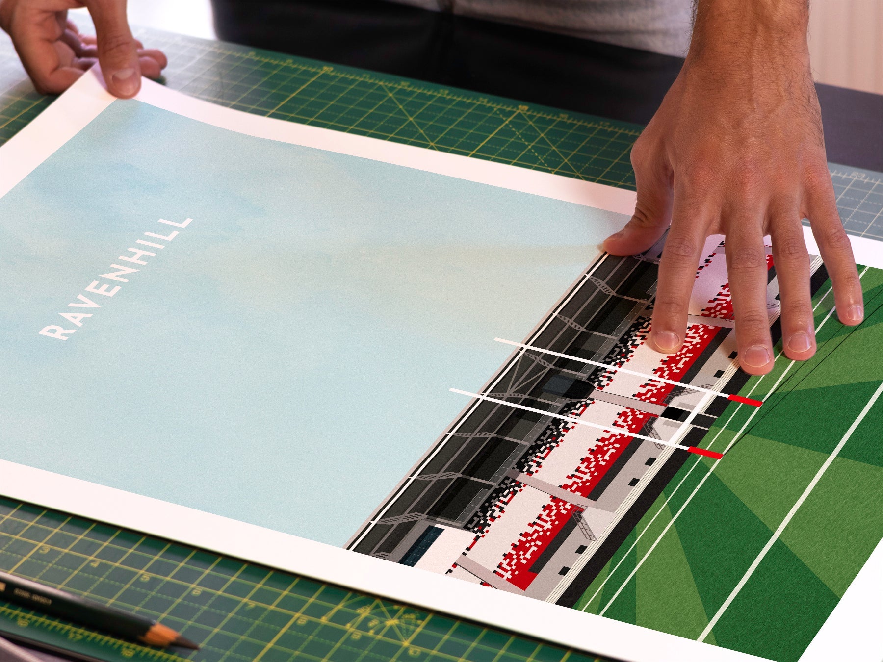A photo in our printing studio, of one of our illustrated art prints of Ravenhill /Kingspan Stadium after it has been printed and is about to be packaged.